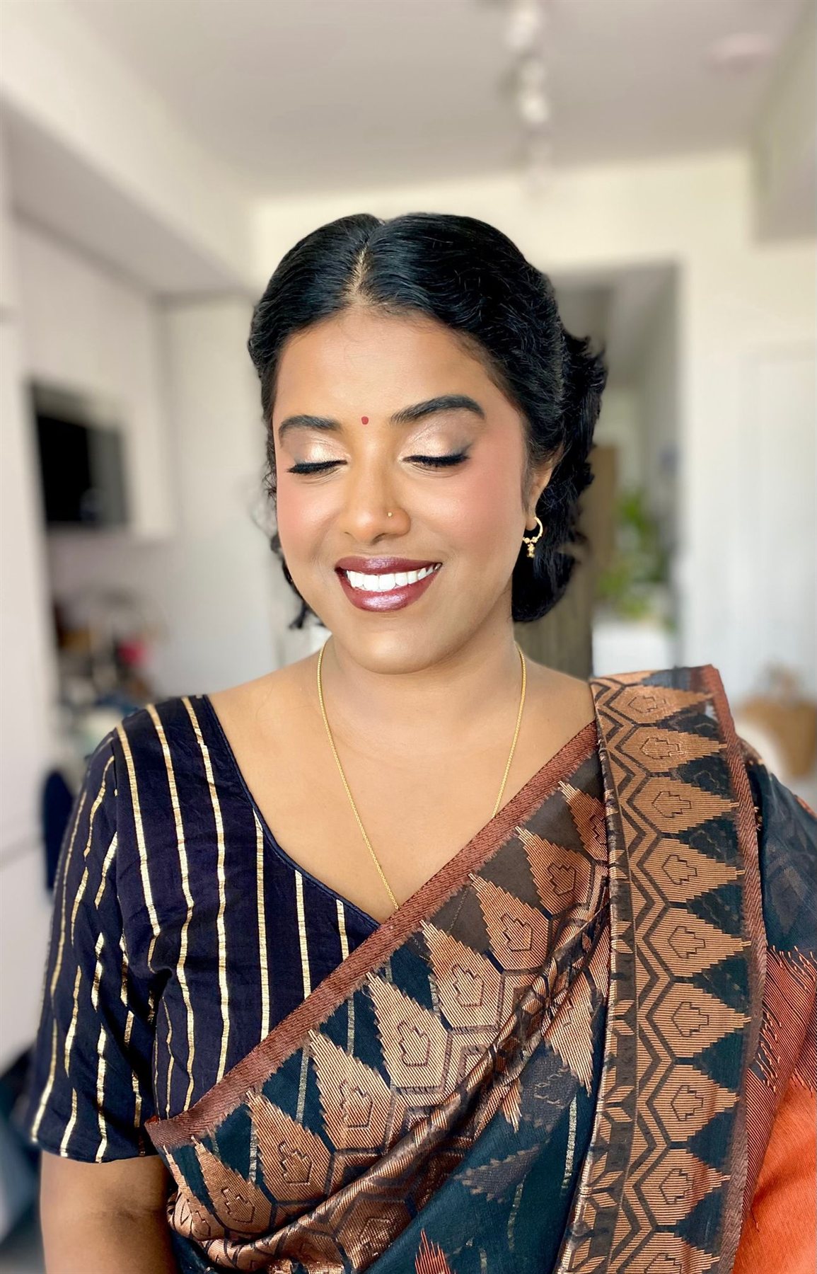 Elegant event makeup with warm glam eyes on a client in a saree, Greater Toronto Area
